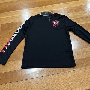 Nwt Under Armour long sleeve loose fit  football shirt size small.